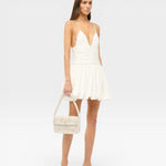 JONES + CO Tommy beaded shoulder bag with 3D floral embellishments and vegan leather trim. White.