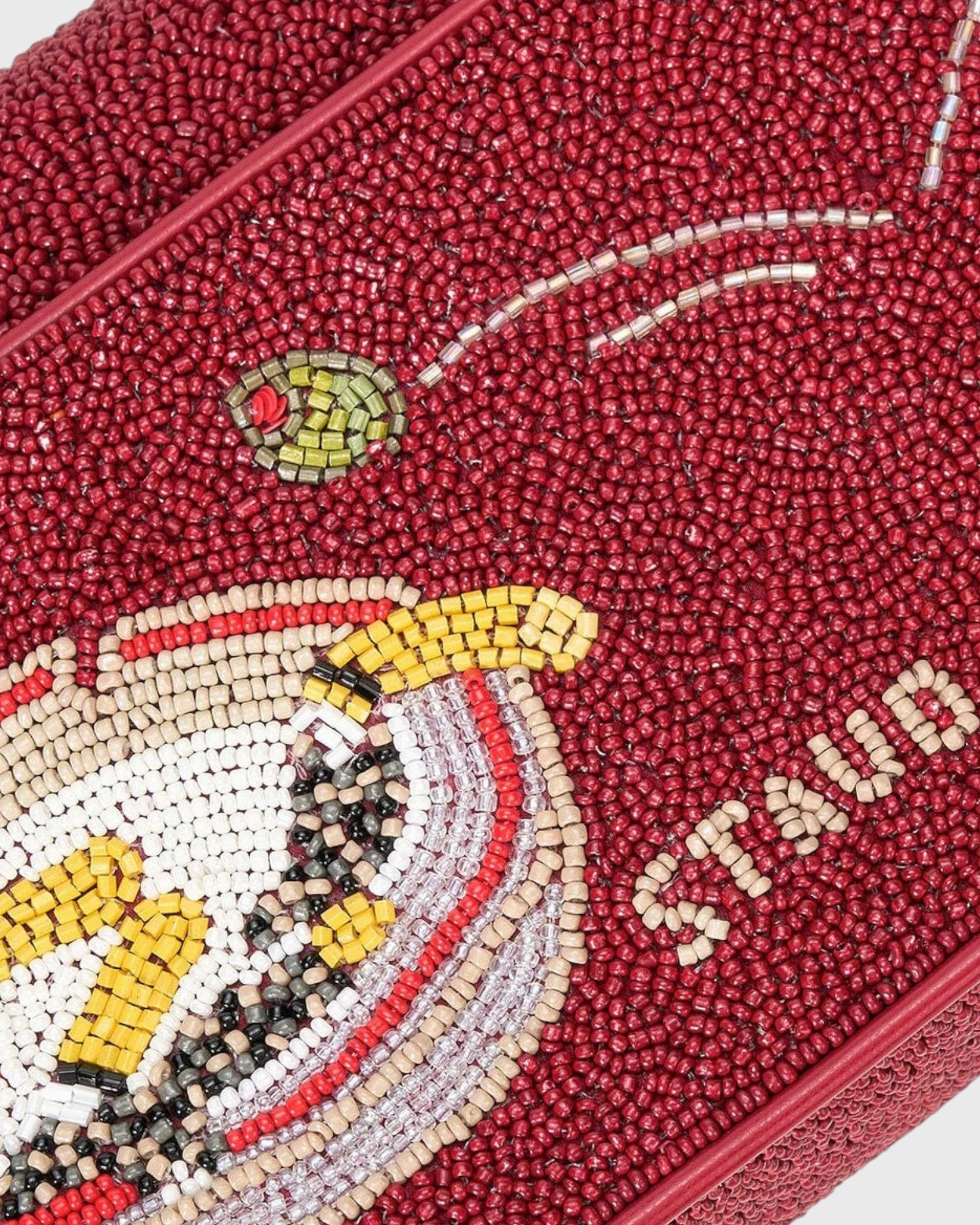 JONES + CO Tommy beaded shoulder bag in deep red with a playful martini glass graphic and vegan leather piping