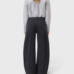JONES + CO Tori X dark gray barrel fit denim jeans with iconic X-pockets and offset side seams, back view.