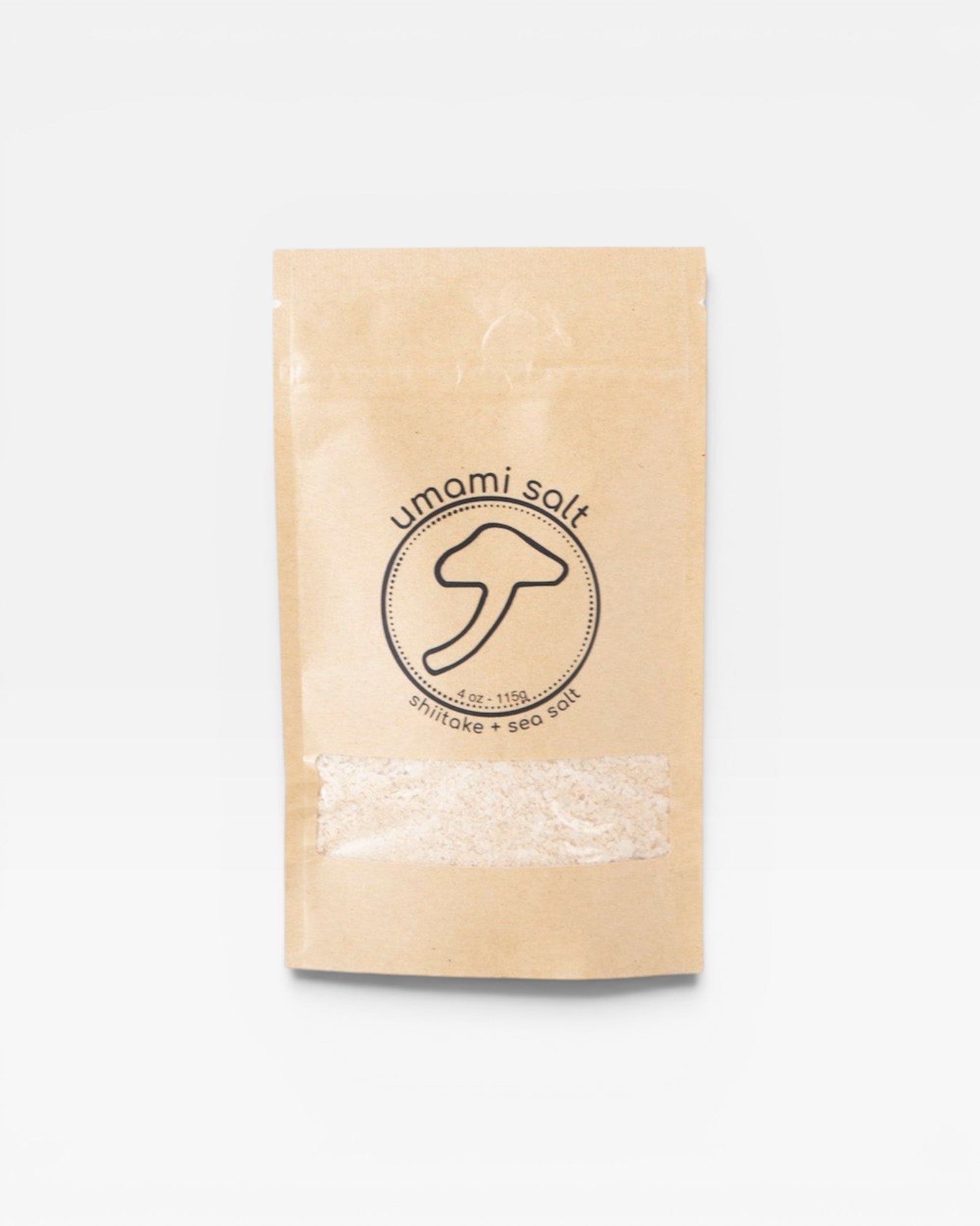 JONES + CO Umami Salt in a brown paper pouch with a shiitake mushroom logo and clear window for viewing the salt.