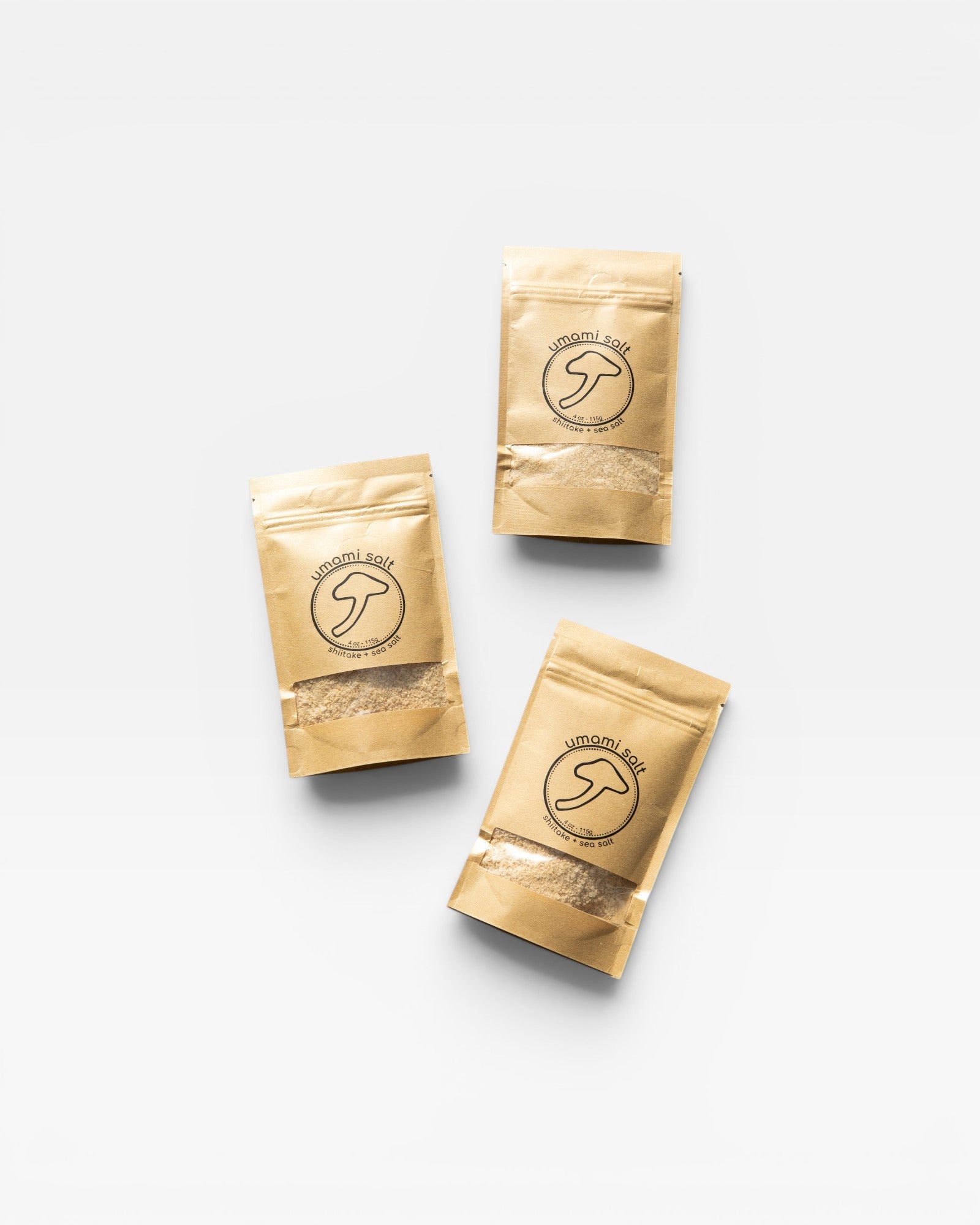 Three JONES + CO Umami Salt pouches featuring shiitake mushroom and sea salt blend in minimalist kraft paper packaging