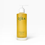 JONES + CO Undaria Algae Body Oil, a fragrance-free seaweed body oil in a yellow pump bottle that improves elasticity and firms skin.