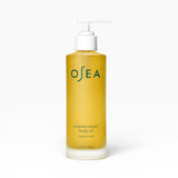 JONES + CO Undaria Algae Body Oil, a fragrance-free seaweed body oil in a yellow pump bottle that improves elasticity and firms skin.