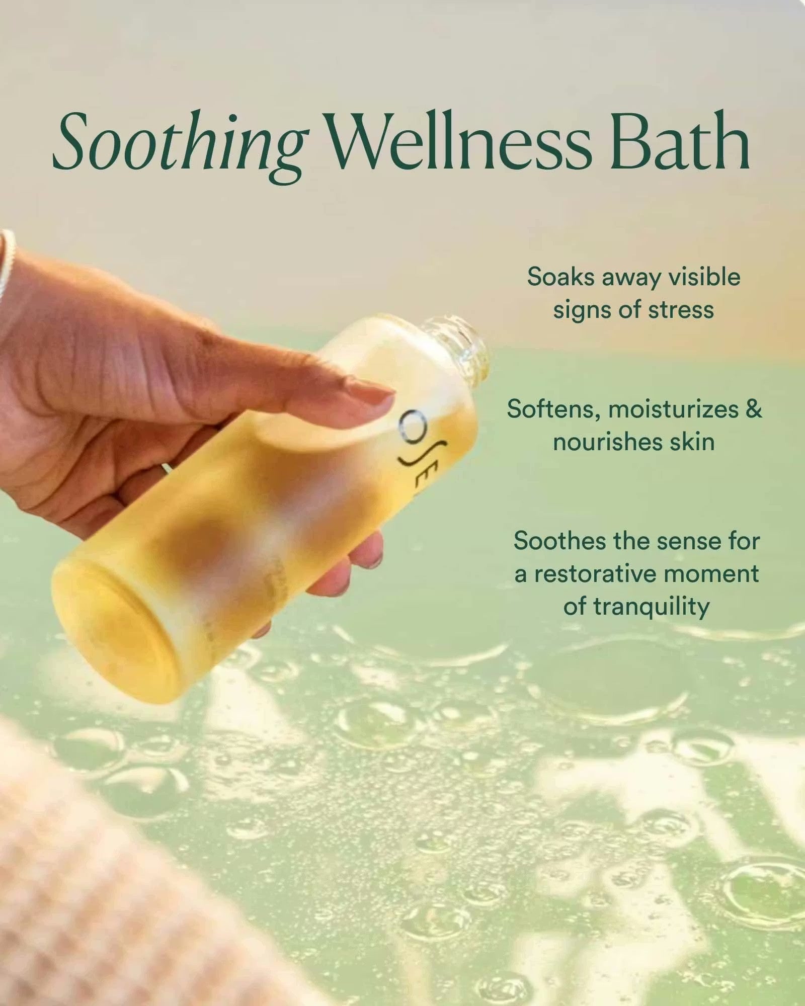 JONES + CO Vagus Nerve Bath Oil bottle being poured into a bubbly bath for stress relief and skin softening.