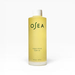 JONES + CO Vagus Nerve Bath Oil bottle, a pale yellow oil with white cap, promotes serenity and softens skin.