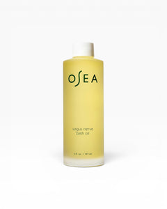 JONES + CO Vagus Nerve Bath Oil bottle, a pale yellow oil with white cap, promotes serenity and softens skin.