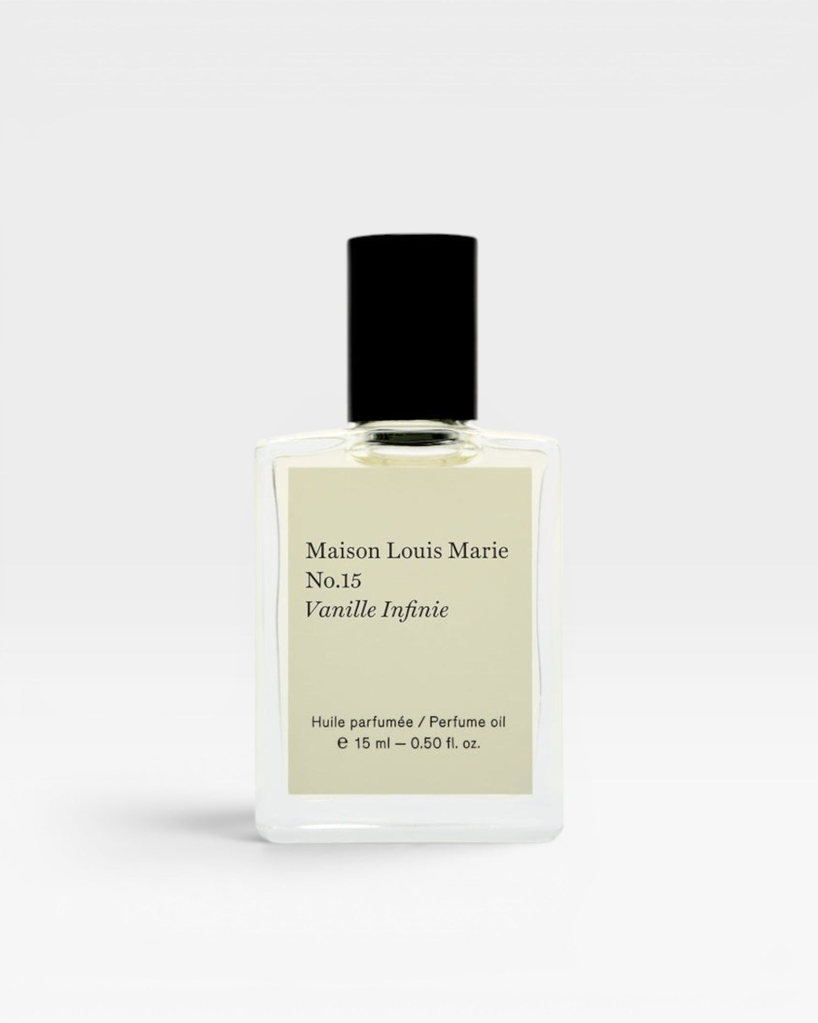 JONES + CO No.15 Vanille Infinie perfume oil in a clear glass bottle with a black cap and cream label.
