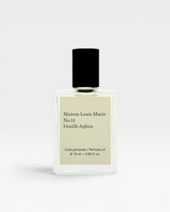 JONES + CO No.15 Vanille Infinie perfume oil in a clear glass bottle with a black cap and cream label.