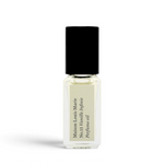 JONES + CO No.15 Vanille Infinie travel size perfume oil in a clear glass rollerball bottle with a black cap.