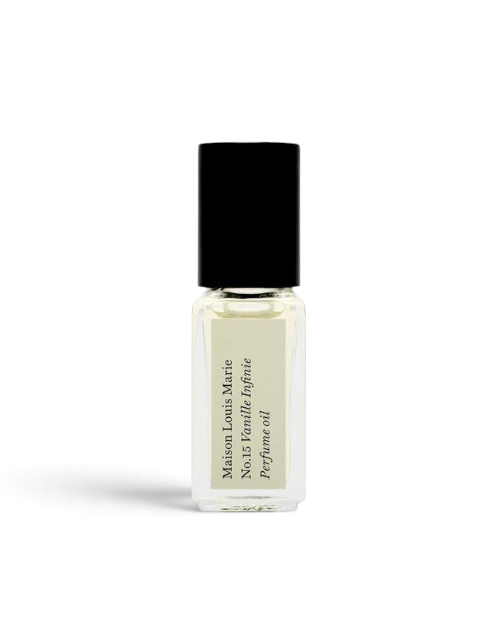 JONES + CO No.15 Vanille Infinie travel size perfume oil in a clear glass rollerball bottle with a black cap.