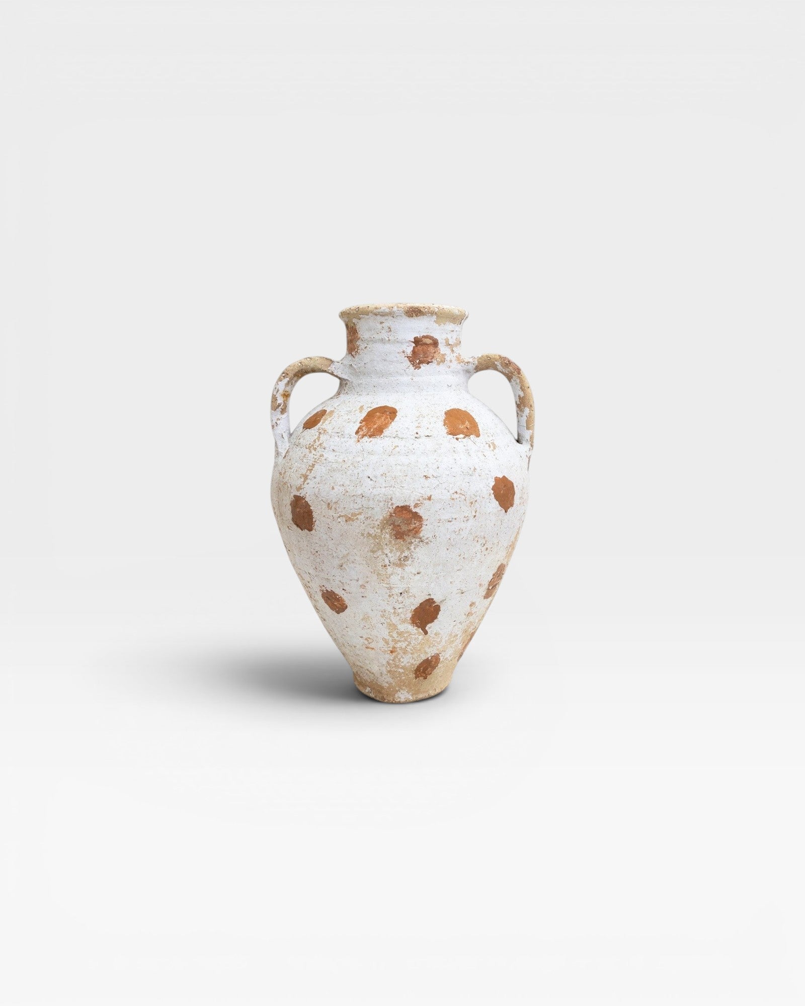 JONES + CO vintage Anatolian polka dot olive jar, white limewash with terracotta dots, hand-thrown pottery from Turkey.