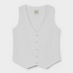 JONES + CO Violette Vest in white heavyweight linen with Italian handcrafted buttons. Sleeveless V-neck vest.