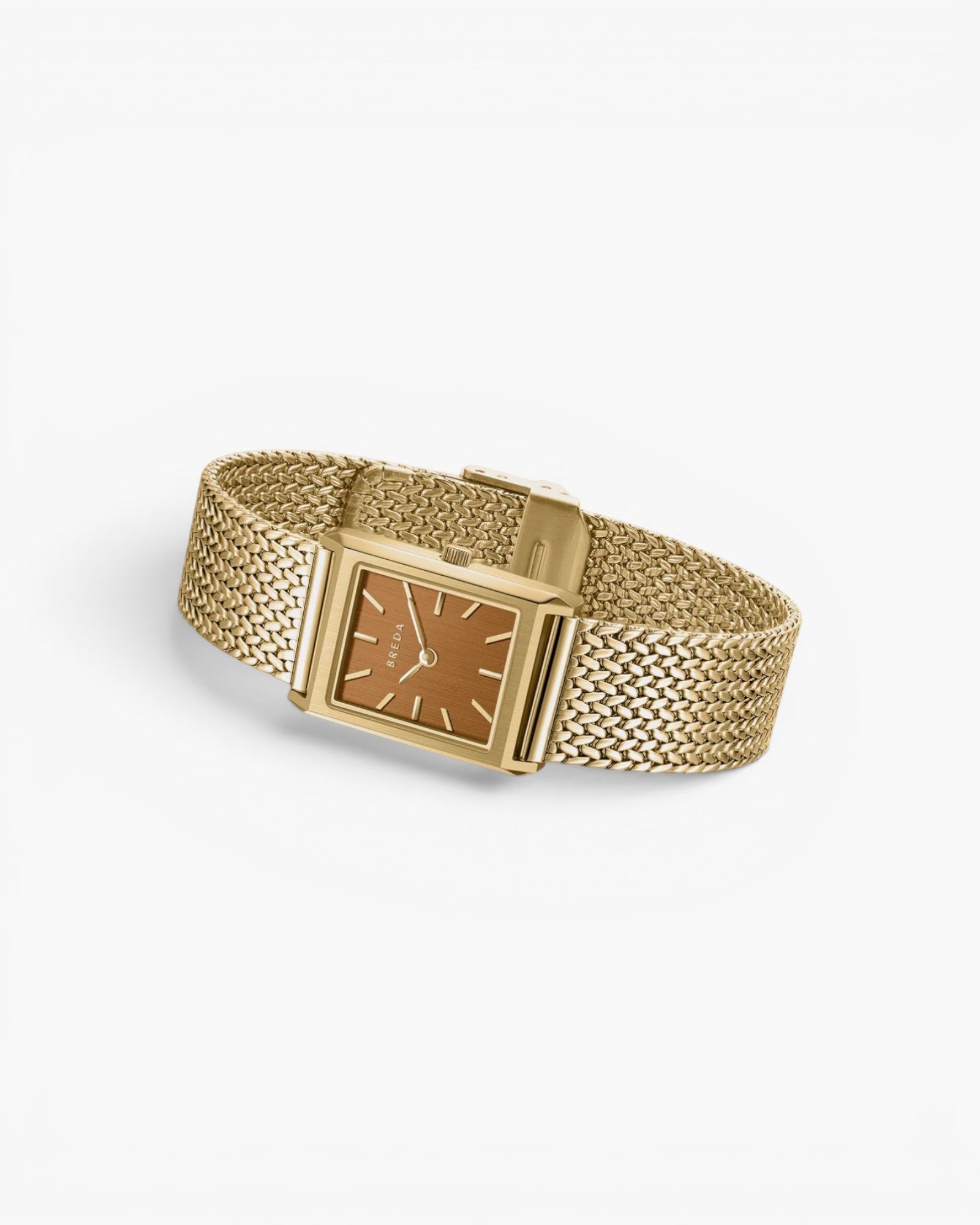 JONES + CO Virgil Small watch in gold with a 20mm rectangular case, ochre dial, and woven mesh bracelet.