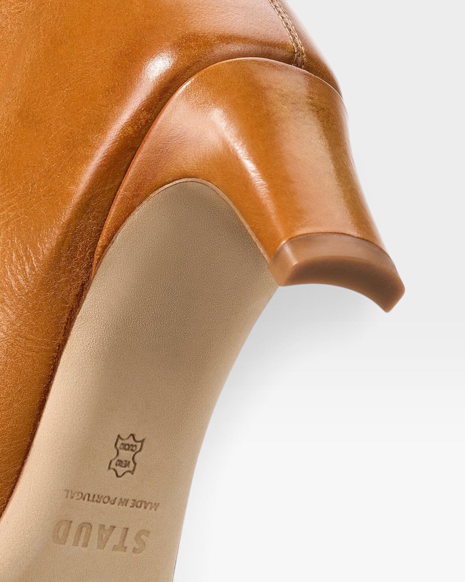 JONES + CO Wally knee-high boot in cashew distressed leather showing the slim heel and sole detail