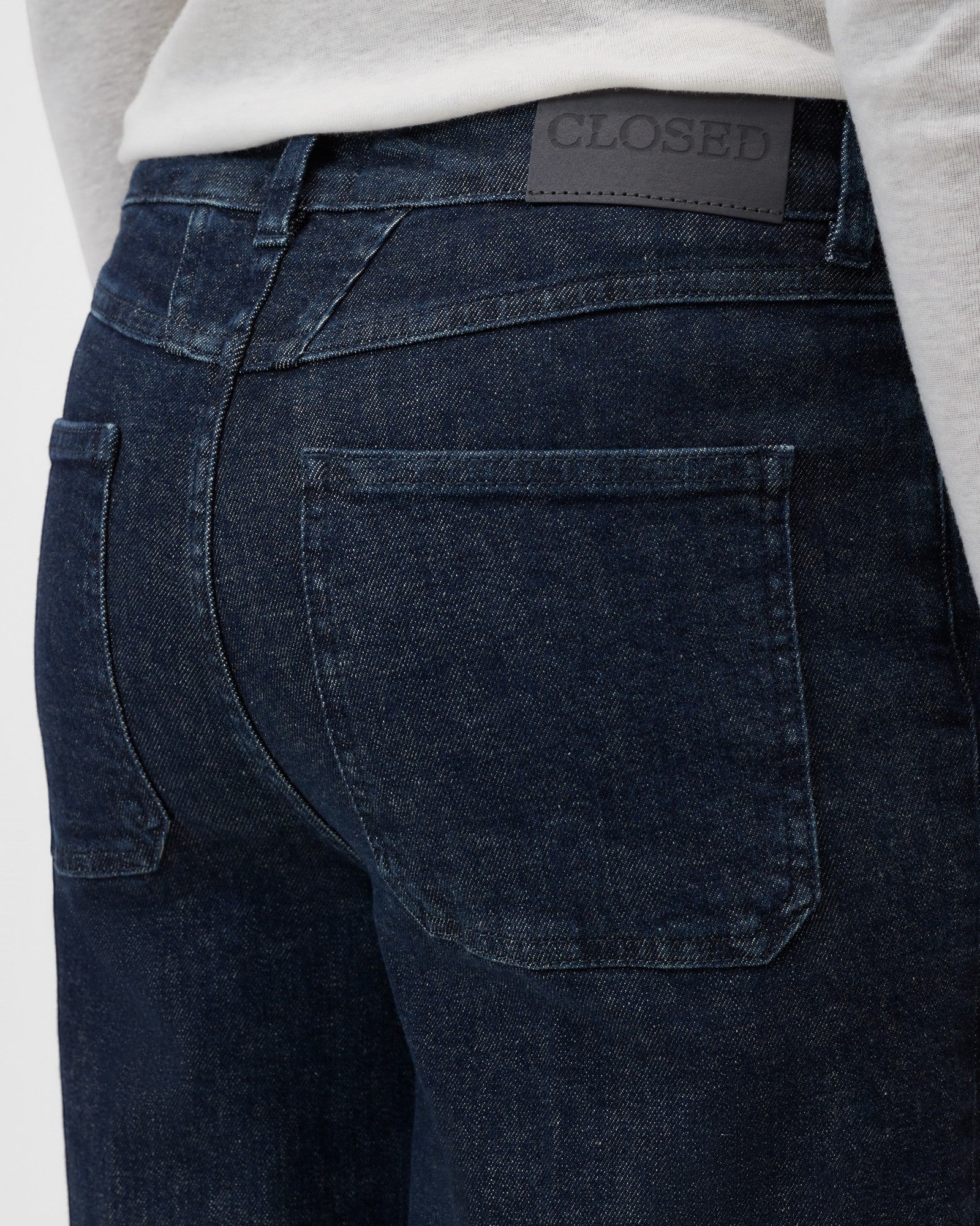 JONES + CO Wera dark blue denim jeans featuring a back leather patch detail and classic pocket stitching