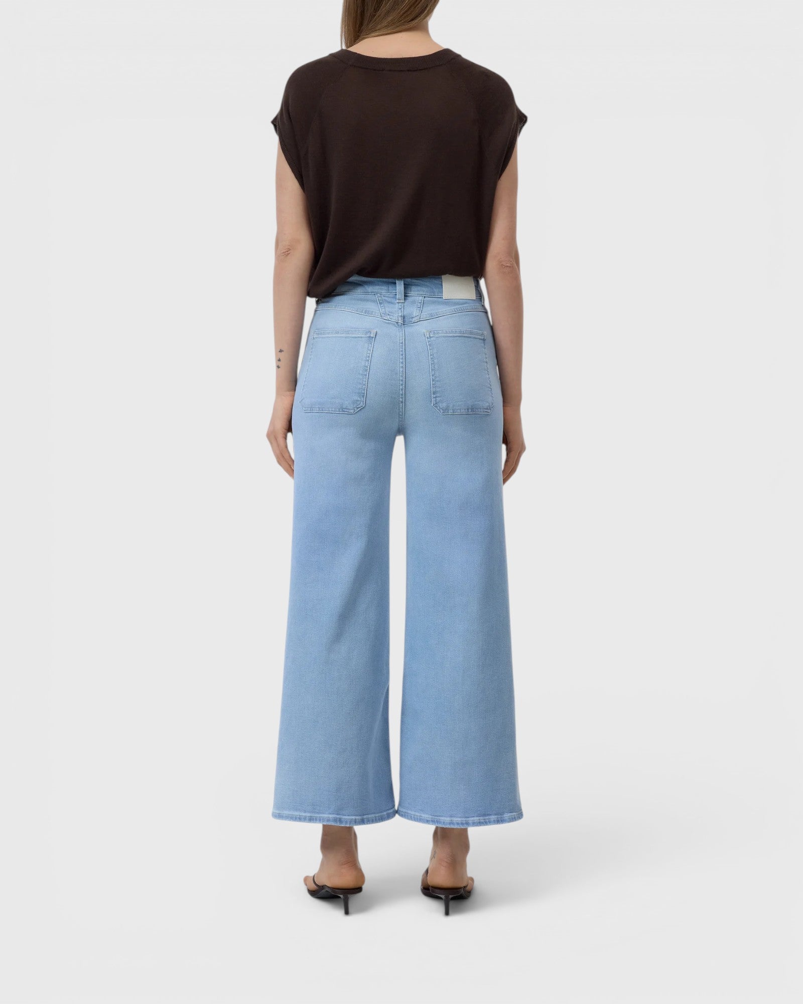JONES + CO Wera light blue super-stretch denim jeans with a high waist and cropped relaxed fit, back view.