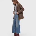 JONES + CO Wera mid blue denim jeans with a wide-leg culotte silhouette and high waist worn with a plaid blazer