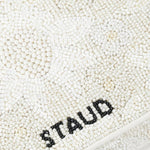 JONES + CO white beaded shoulder bag with "STAUD" logo in black beads. Features 3D flowers and vegan leather piping.