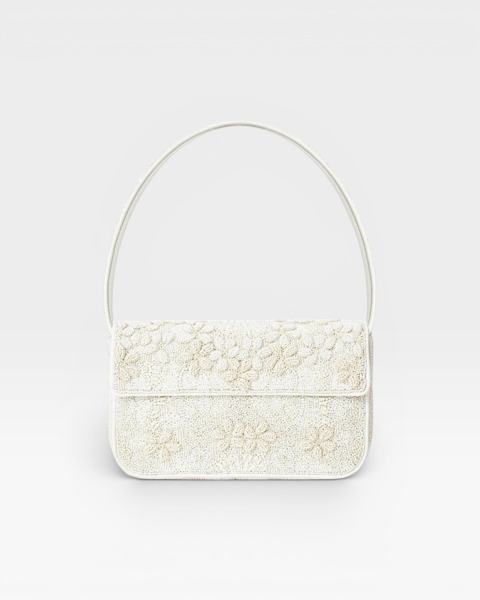 JONES + CO white beaded shoulder bag with 3D floral embellishments and vegan leather piping.