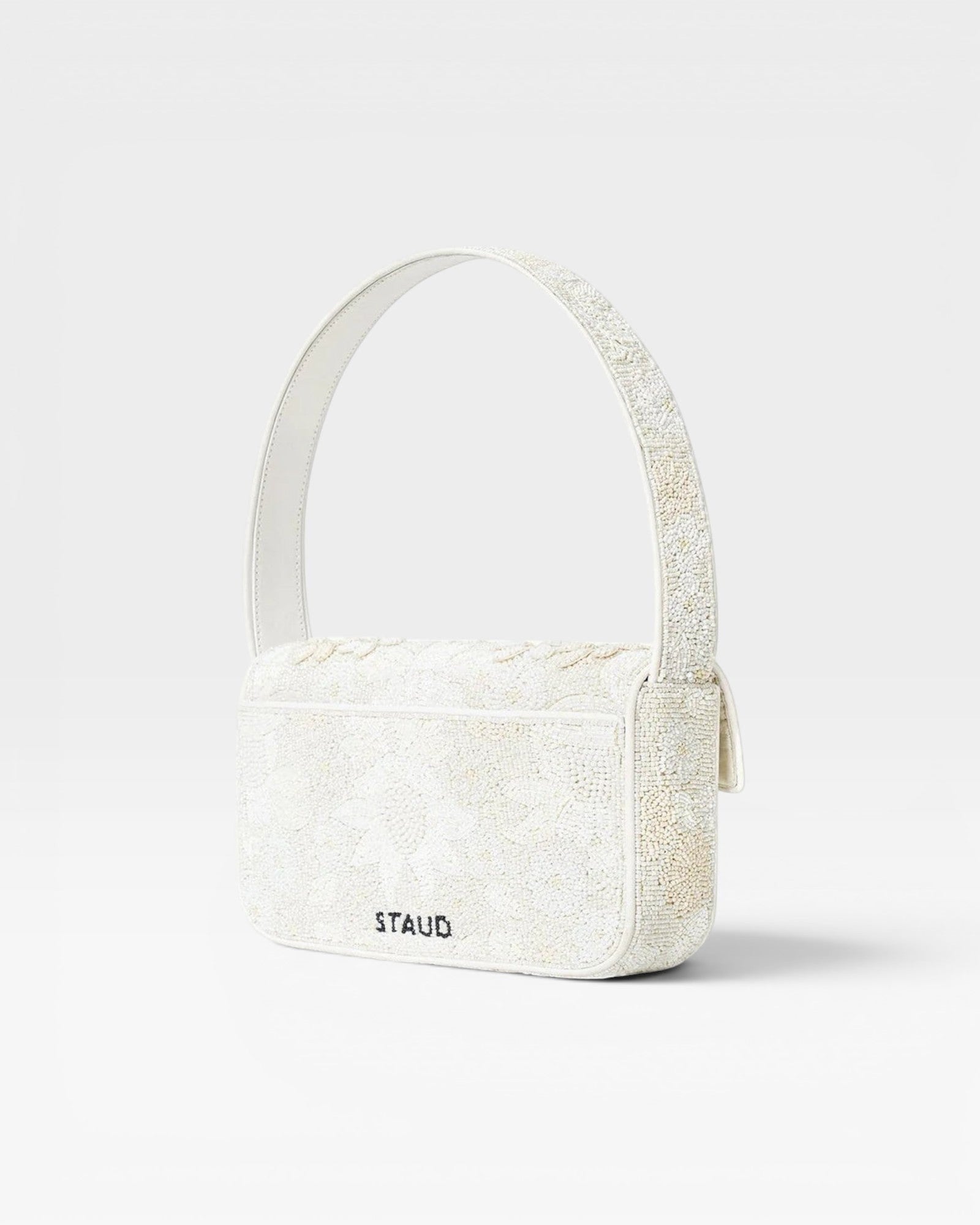 JONES + CO white beaded shoulder bag with floral embroidery and vegan leather trim. Features flap closure and magnetic back pocket.