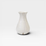 JONES + CO white speckled ceramic bulb vase, handthrown with a flared neck and bulbous base.