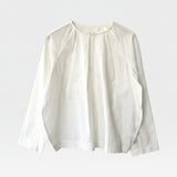 JONES + CO white cotton Julienne long sleeve top with round neckline, keyhole closure, pleating, and raglan sleeves.