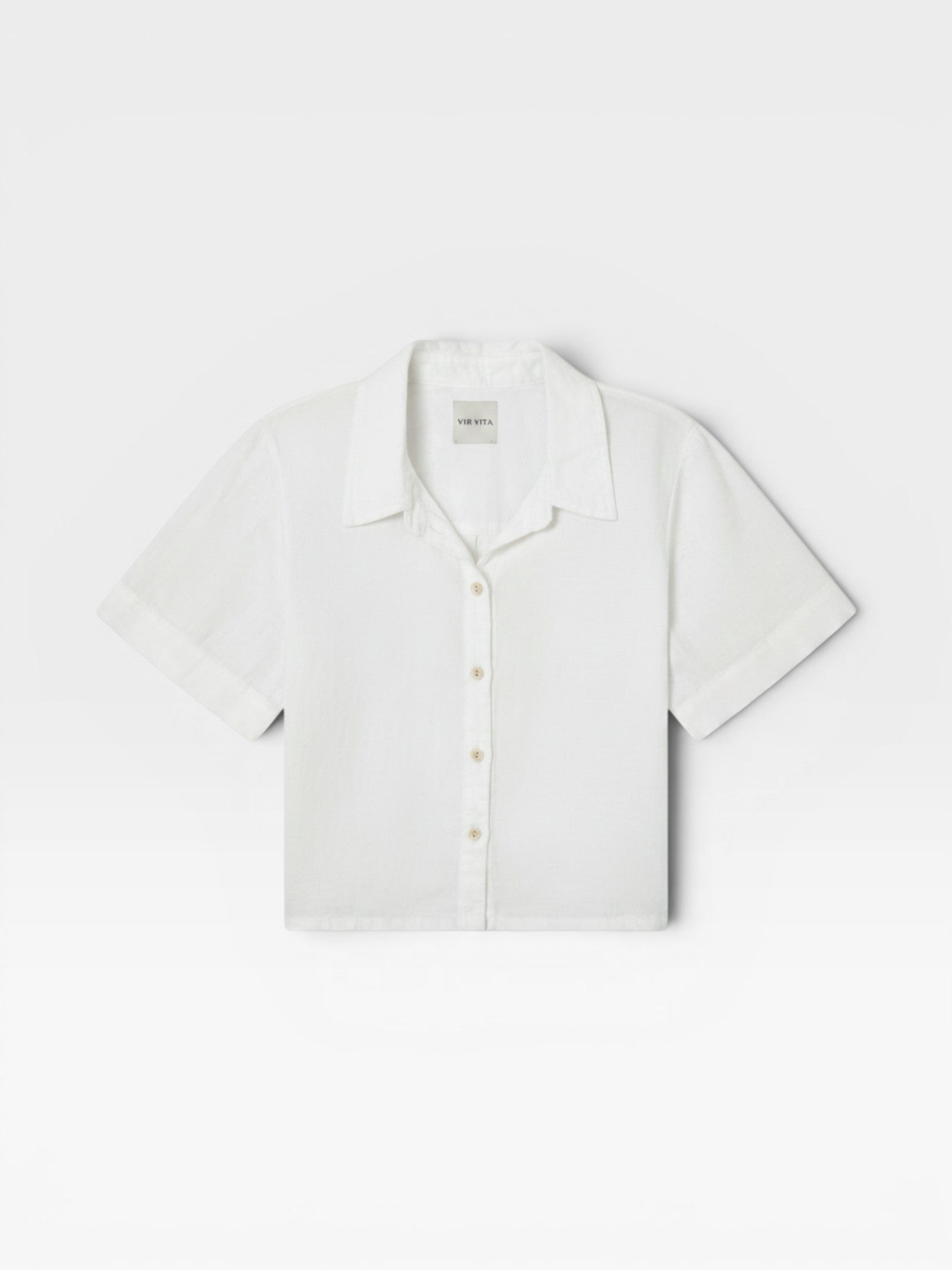 JONES + CO white Anais linen button-down shirt with a minimalist collar and short sleeves in a relaxed cropped fit.
