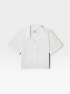 JONES + CO white Anais linen button-down shirt with a minimalist collar and short sleeves in a relaxed cropped fit.