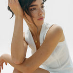 JONES + CO white heavyweight linen Violette Vest with Italian handcrafted buttons, sleeveless design.