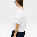 JONES + CO white 100% organic cotton boxy fit short sleeve top with structured panels.