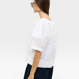 JONES + CO white 100% organic cotton boxy fit short sleeve top with structured panels.