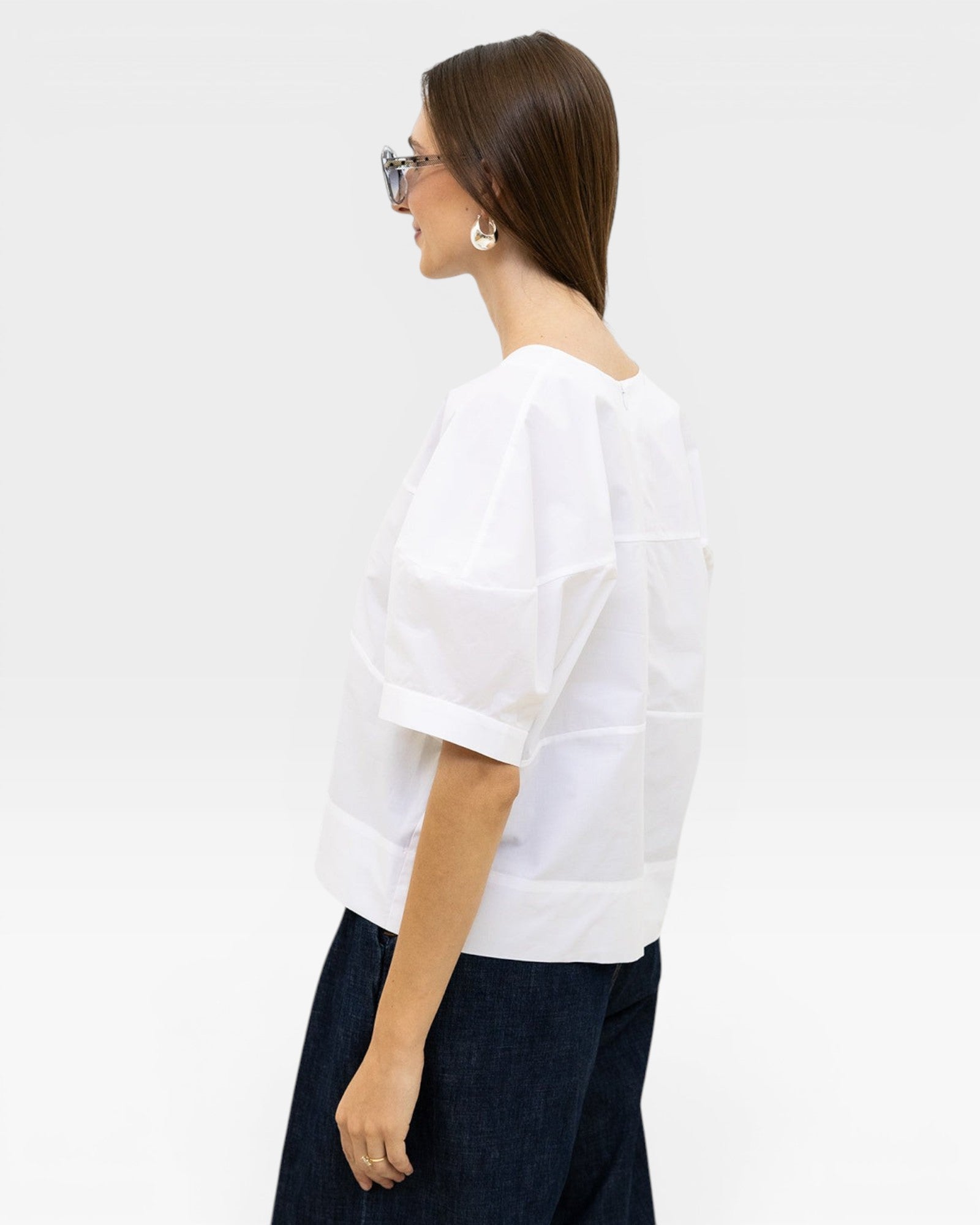 JONES + CO white 100% organic cotton boxy fit short sleeve top with structured panels.