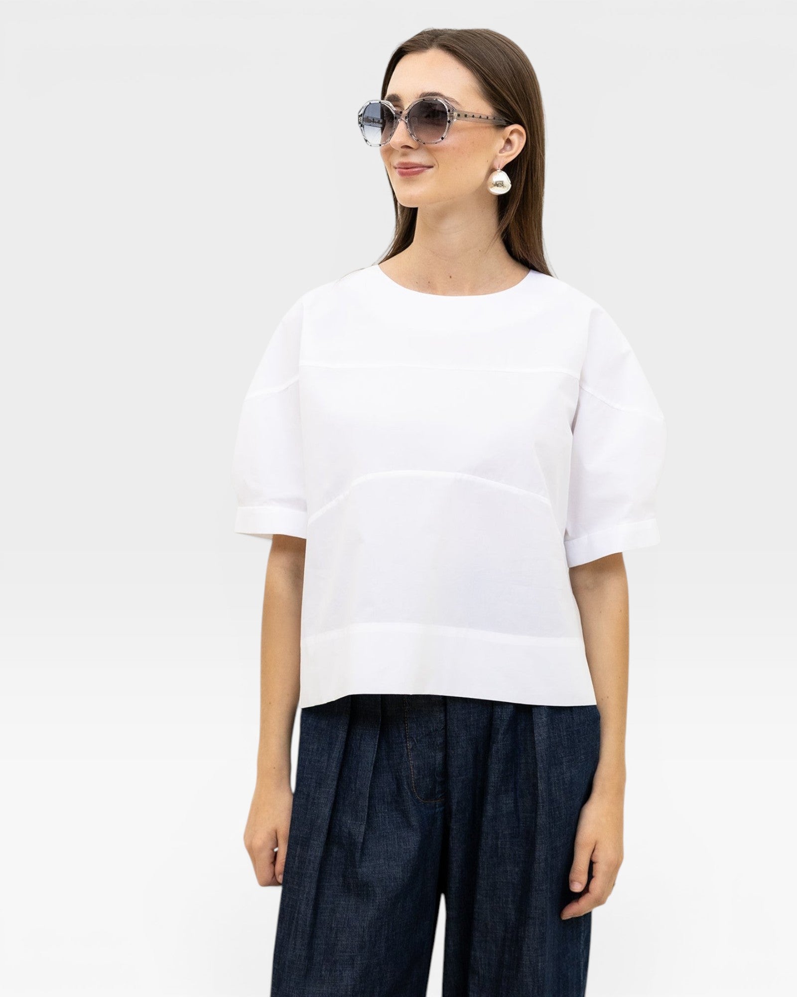 JONES + CO white 100% organic cotton rugby top with a boxy silhouette and subtle horizontal seam details.