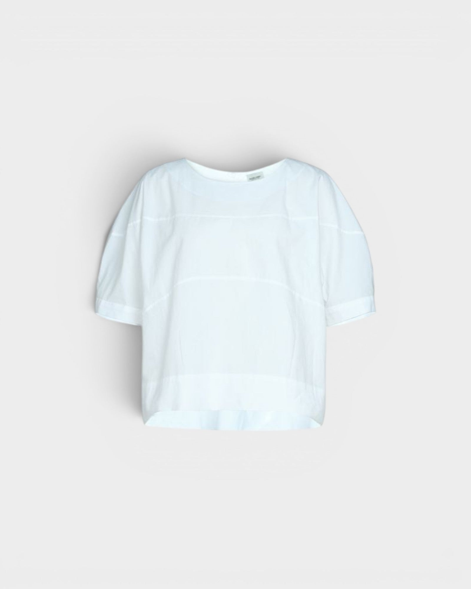 JONES + CO white organic cotton rugby top with a relaxed, boxy silhouette and subtle horizontal seam details.
