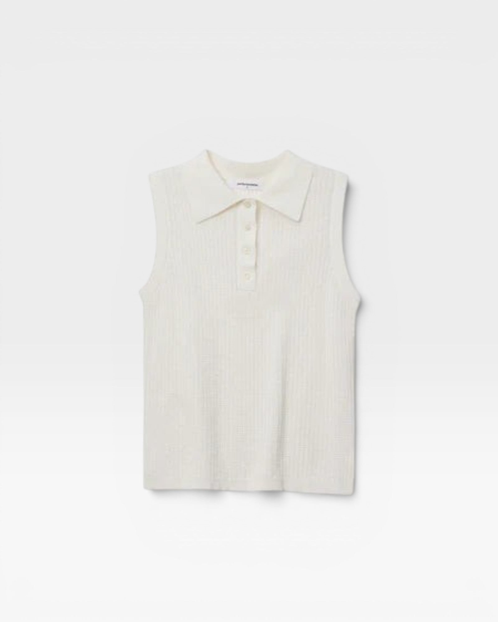 JONES + CO white sleeveless polo tank with pointelle knit texture and ribbed hem.