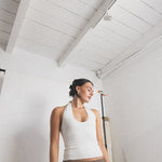 JONES + CO white ribbed halter top with a flattering neckline, paired with a brown crochet skirt.
