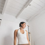 JONES + CO white ribbed halter top with a flattering neckline, paired with a brown crochet skirt.