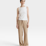 JONES + CO white supima cotton ribbed knit high-neck tank top with a fitted silhouette.