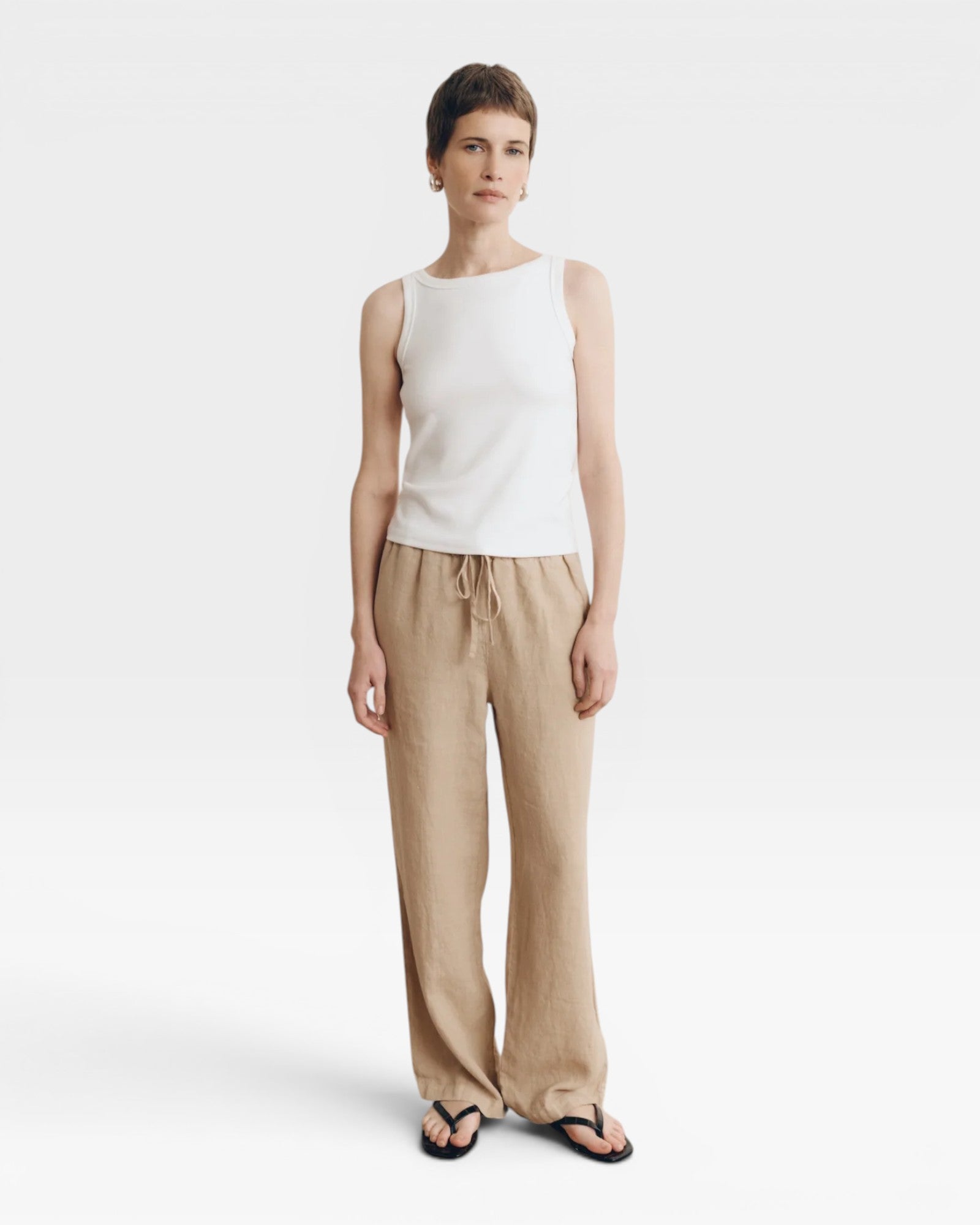 JONES + CO white supima cotton ribbed knit high-neck tank top with a fitted silhouette.