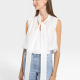 JONES + CO white sleeveless blouse with tie-neck detail, lightweight fabric, and flattering silhouette.