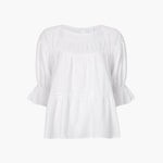 JONES + CO white 100% Pima cotton lawn Sol Top blouse with boat neck, crochet trim, and puff sleeves with ruffled cuffs.