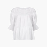 JONES + CO white 100% Pima cotton lawn Sol Top blouse with boat neck, crochet trim, and puff sleeves with ruffled cuffs.