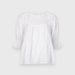 JONES + CO white 100% Pima cotton lawn Sol Top blouse with boat neck, crochet trim, and puff sleeves with ruffled cuffs.