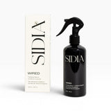 JONES + CO WIRED Body Serum in black spray bottle with tea leaves and eucalyptus scent. Lightweight and hydrating.
