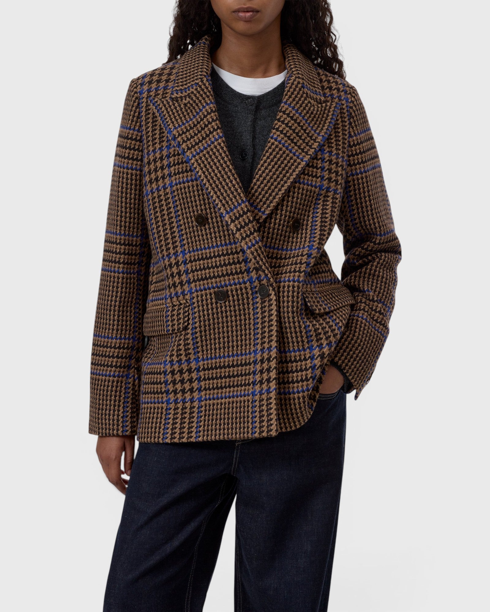 JONES + CO wool-blend double-breasted blazer in sand beige with a blue and brown oversized check pattern.