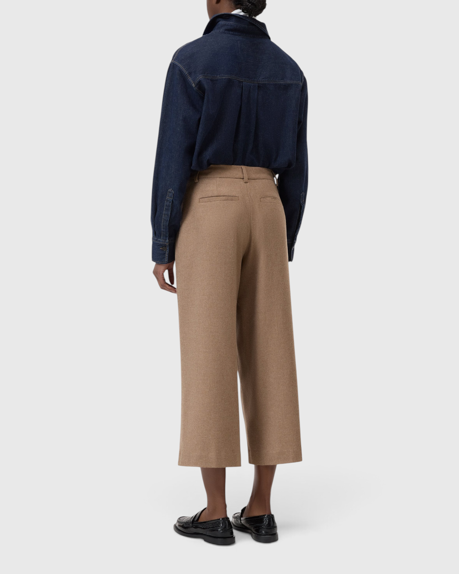 JONES + CO Wren wide-leg cropped trousers in wheat beige wool-viscose flannel, back view on a model.