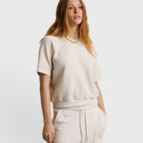 JONES + CO Ziggy short sleeve sweatshirt in sugar off-white with raglan sleeves and a relaxed fit on a model.