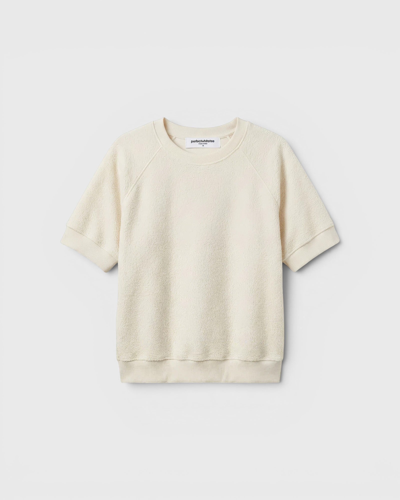 JONES + CO Ziggy short sleeve sweatshirt in sugar cream with raglan sleeves and a relaxed fit.