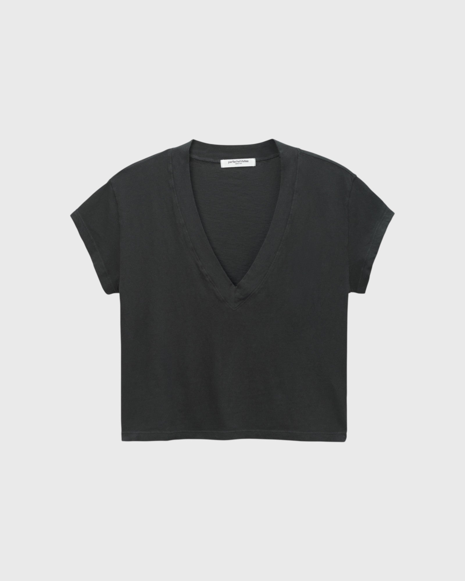 JONES + CO Alanis V-neck tee in vintage black recycled cotton with a relaxed cropped fit and short sleeves.