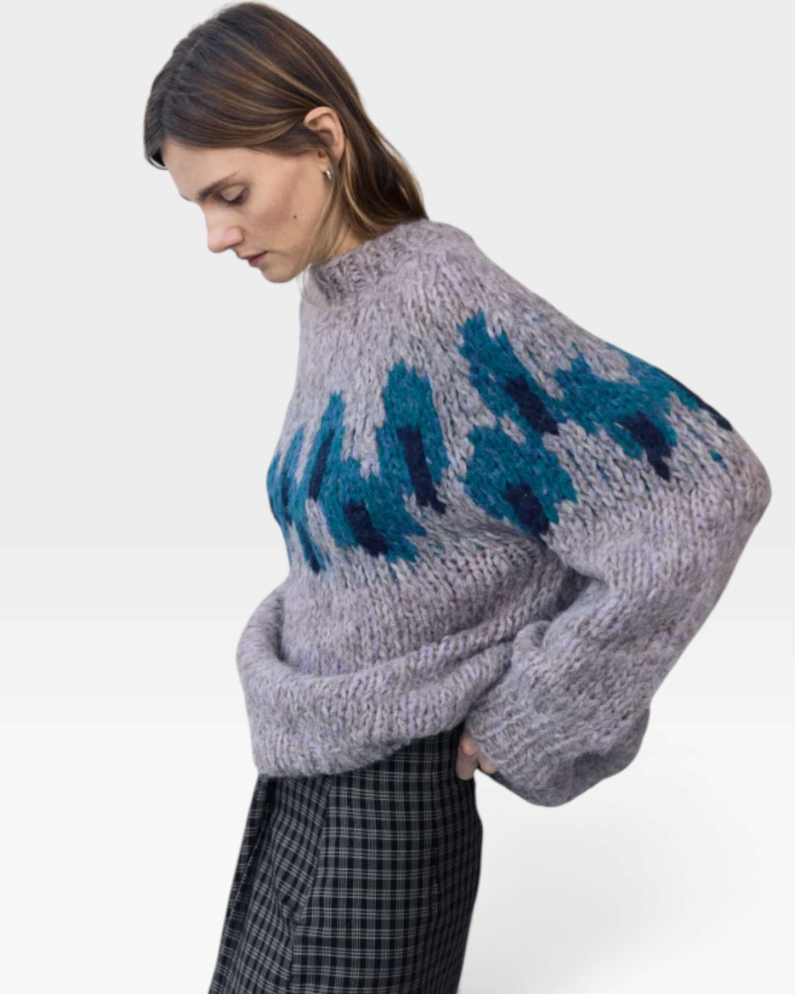 JONES + CO fleecy alpaca blend raglan pullover in grey with a blue peacock intarsia graphic pattern on the chest.